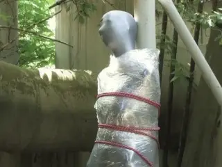 Bondaged and Cocooned Slave Girl in the Mystery Garden - Full Encasement Fetish in Zentai Body Bag