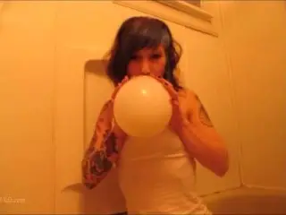 Tattooed Looner Girl tries to Pop Balloons in the Shower