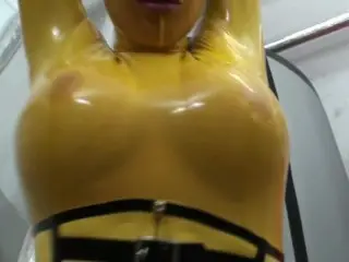 Girl Full Encased in Yellow Latex Catsuit + Fishnets makes self Bondage