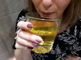 Drinking Piss together from a Glass. the Golden Drink