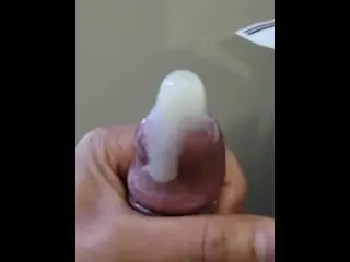 Jacking off Moaning Busting a Hard Nut in a Condom