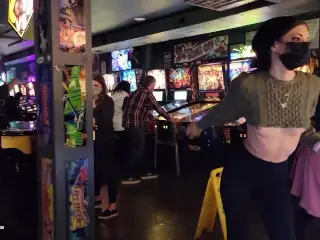 Brazenly Flashing Boobs in a Busy Arcade