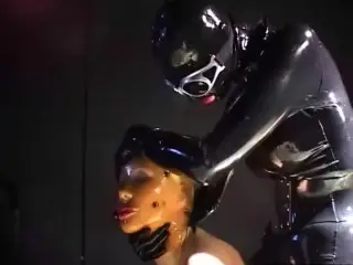 Two Sexy Lesbians Full Encased in Latex Suits have Fun in her Rubber Skins - Part 2