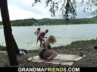 Old blonde granny and boys teen outdoor threesome