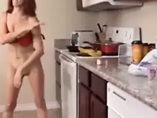 Skinny mature redhead has a food fetish in the kitchen