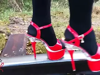 Lady L walking metal road with sexy red high heels!