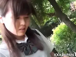 Japanese schoolgirl playing with her pussy over panties