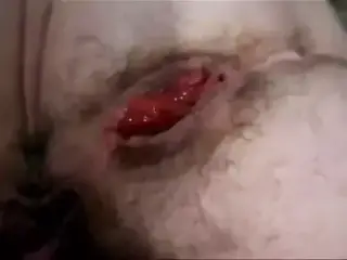 Spreading her long pussy lips