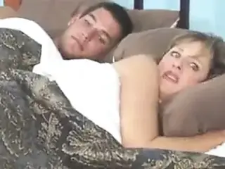 Mom and step son share with bed
