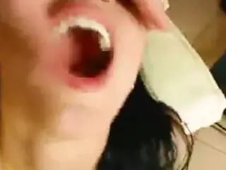 Cute girl eats a nice mixture of tasty sperm