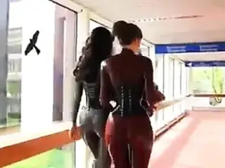 2 hot women in tight latex catsuits