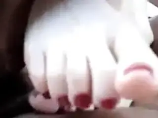 under the table footjob