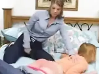 Dominate lesbian spanking another girl