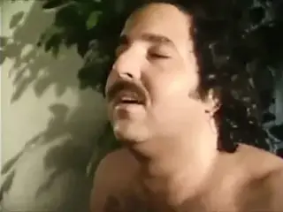 Raven Richards gives Ron Jeremy a blowjob