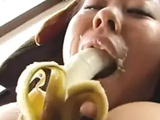 Big tits asian sucking a banana