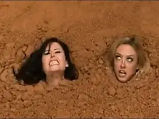 2 Nude Busty Women in Quicksand