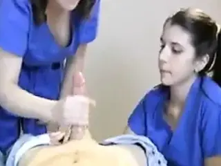 Two Nurses Milk Their Patient