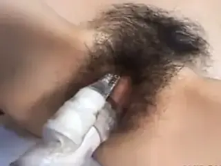 Asian whore has her hairy muff toy fucked well