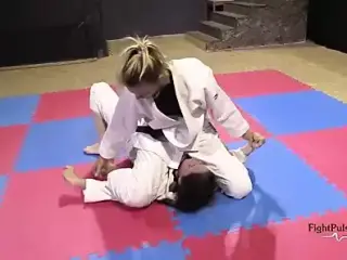 Girls wrestling in kimonos (pindown match)