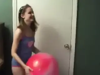 Kitty blowing bubbles in her miniskirt