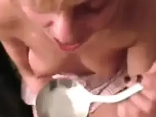 Eats cum from spoon