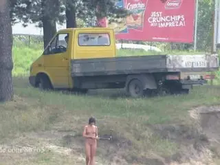 Ola walking alone naked on a public beach (voyeur version)