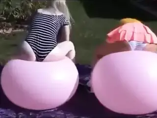 beautiful blondes riding balloons