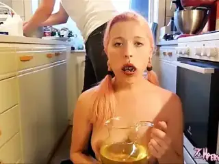 Beauty drinks urine from a jug