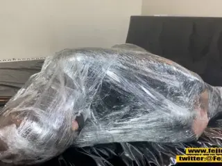 Fejira com Fetish girl covered in plastic cling film