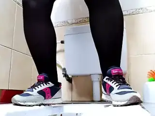 Milf pissing in public toilet