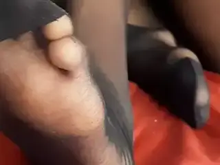 Ebony in black Pantyhose with nice small feet