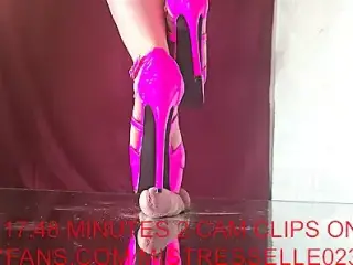 Mistress Elle tortures her slave's cock with her pink high heels