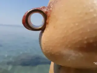 nippleringlover - horny milf pissing on the nude beach, pierced pussy, wide open, huge pierced nipples