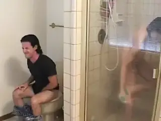 Fellow was sitting on the chair and became very lusty watching the girl in the shower