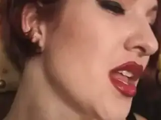 Wild leather doms with sexy red lipstick pinch and suck