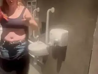 Stepmom joins horny stepson in cinema toilet to help release his big build up flashes him and sucks his Cock