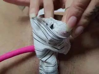 naked woman uses vibrator on her pussy