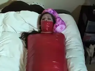 Hot brunette mummified by tape and vibed