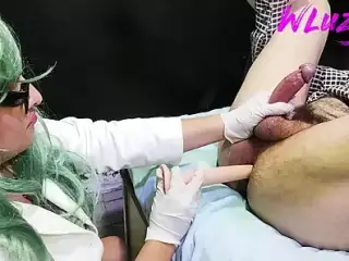 doctor performs anal exam whith long dildo