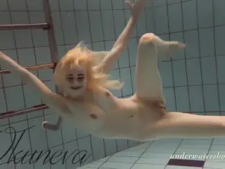 Blonde babe Okuneva shaved pussy underwater swimming