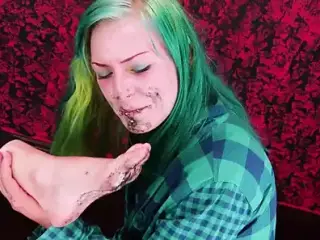 Girl licks dirty feet of a friend