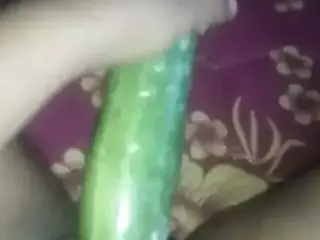 Busty slut inserts cucumber in her cunt