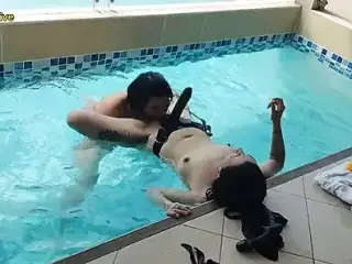 woman fucks man in the ass with strap-on in the pool ass sucking PEGGING