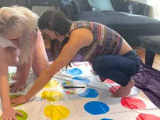 A sexy twister strip game with a lesbian couple