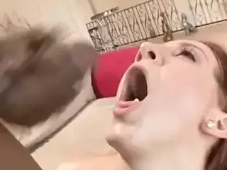 Horny red head gets bent over and fucked doggy style by black stud