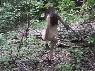 Mel walks naked in the woods